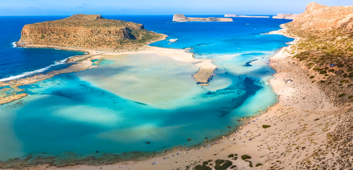 Aerial view of Balos lagoon with its white sand and turquoise shallows in western Crete