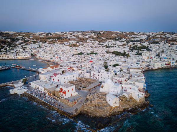 Aerial sunset view of mykonos old town and port