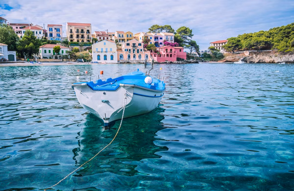 White fishing boat in the blue rippled sea water